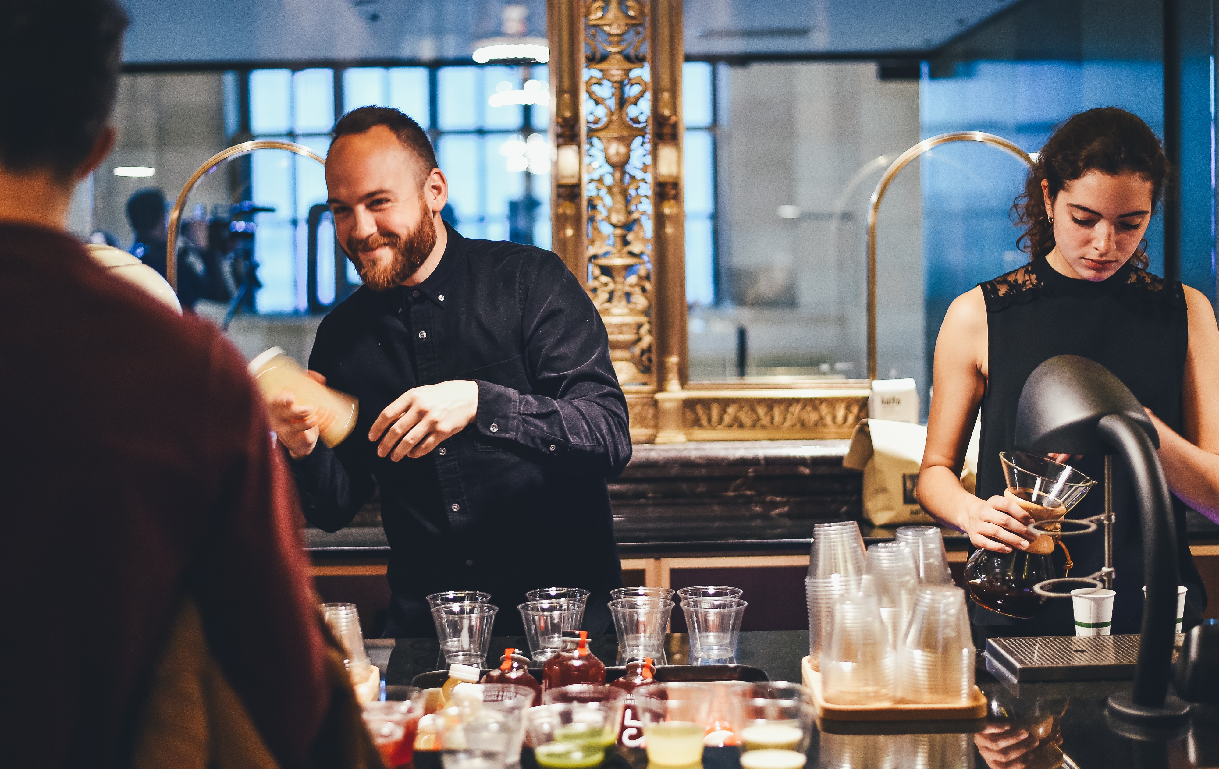 happy male and a female bartender