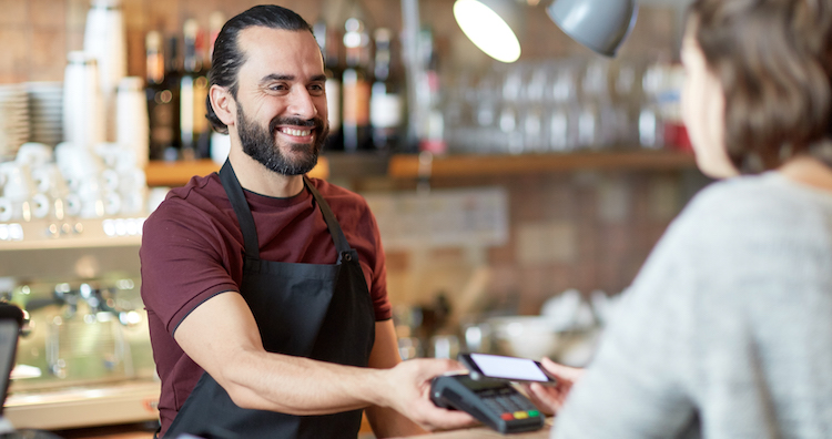 customer service - barman and woman with card reader and smartphone