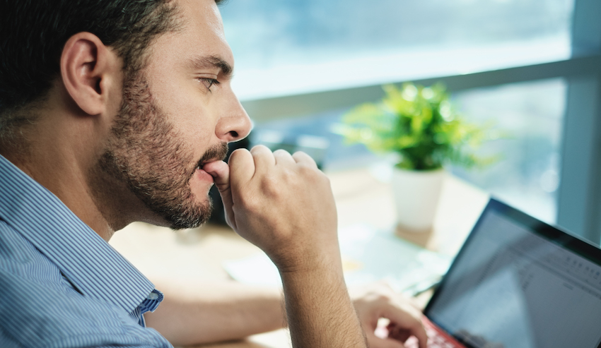 Anxious Businessman Biting Nails Working With Business Data Loss