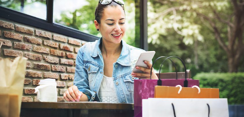 mobile marketing woman shopping outdoor on mobile phone